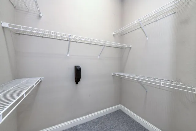 a view of a room with racks on the wall