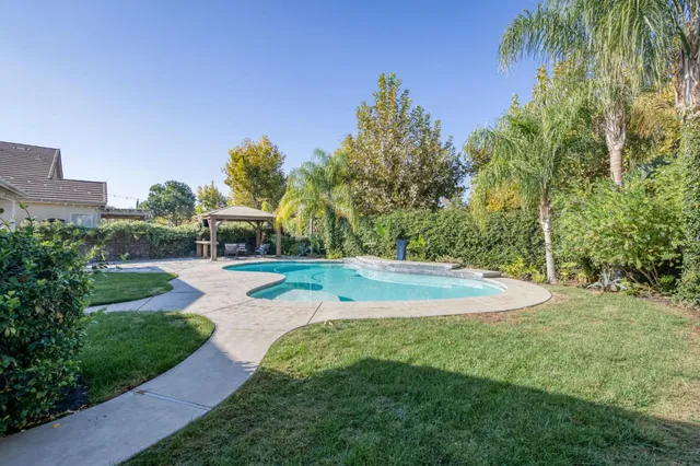 a view of a house with swimming pool