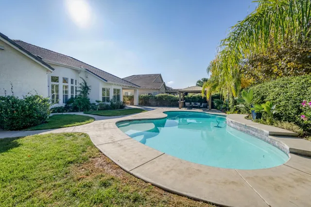 a view of a house with swimming pool