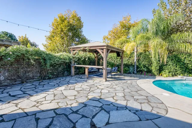 a patio with patio table and chairs