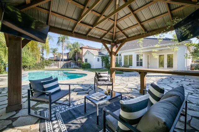 a front view of a house with garden