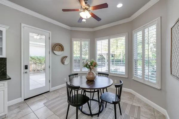 a dining room with furniture and window