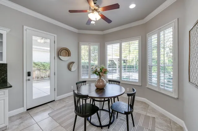 a dining room with furniture and window