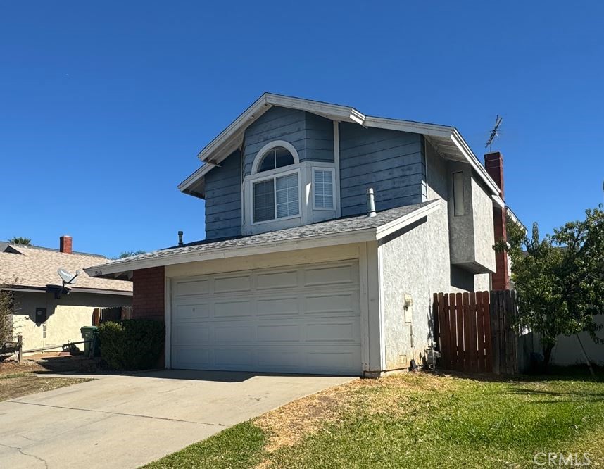13080 Mohican Drive Moreno Valley, CA 92555 - Photo 1 of 38 a front view of a house with a yard