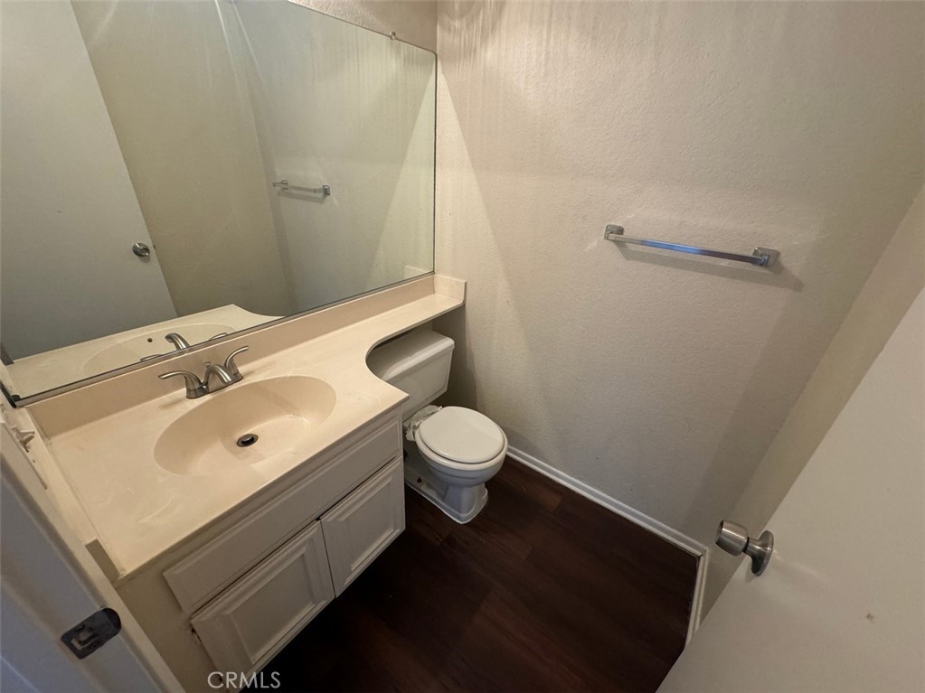 13080 Mohican Drive Moreno Valley, CA 92555 - Photo 14 of 38 a bathroom with a toilet sink and mirror
