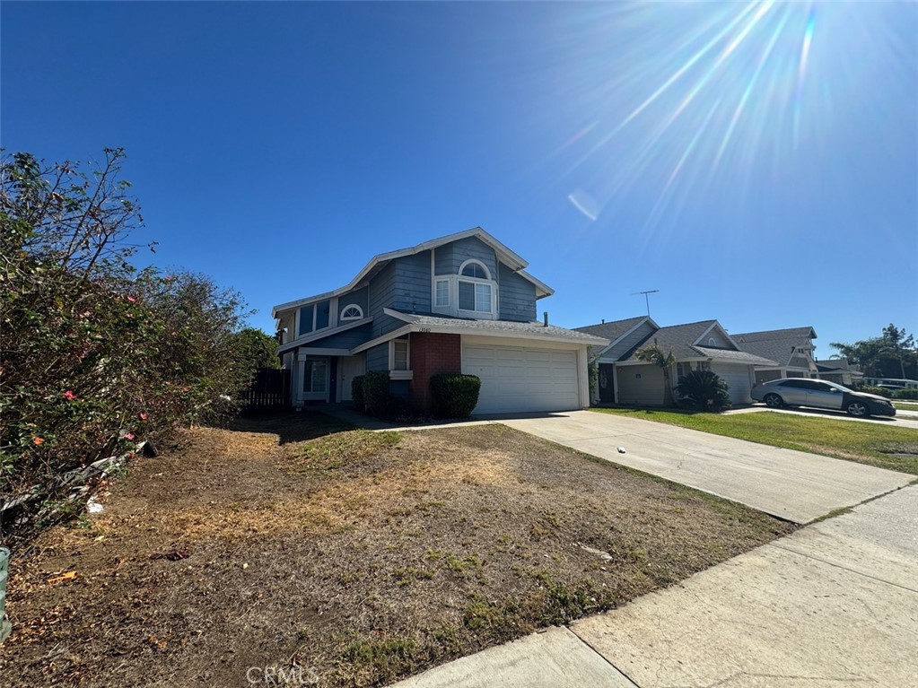 13080 Mohican Drive Moreno Valley, CA 92555 - Photo 2 of 38 a front view of a house with a yard