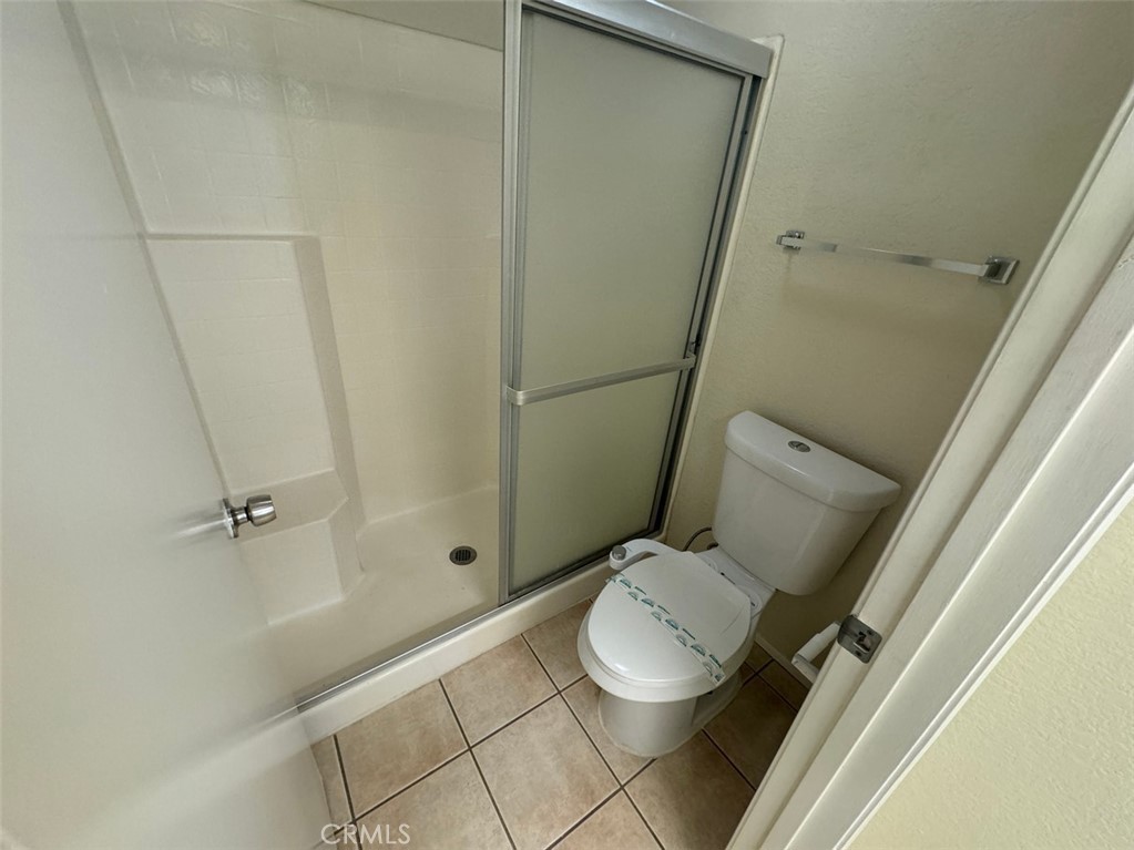 13080 Mohican Drive Moreno Valley, CA 92555 - Photo 27 of 38 a bathroom with a toilet and a shower