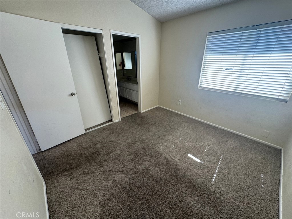 13080 Mohican Drive Moreno Valley, CA 92555 - Photo 29 of 38 an empty room with windows