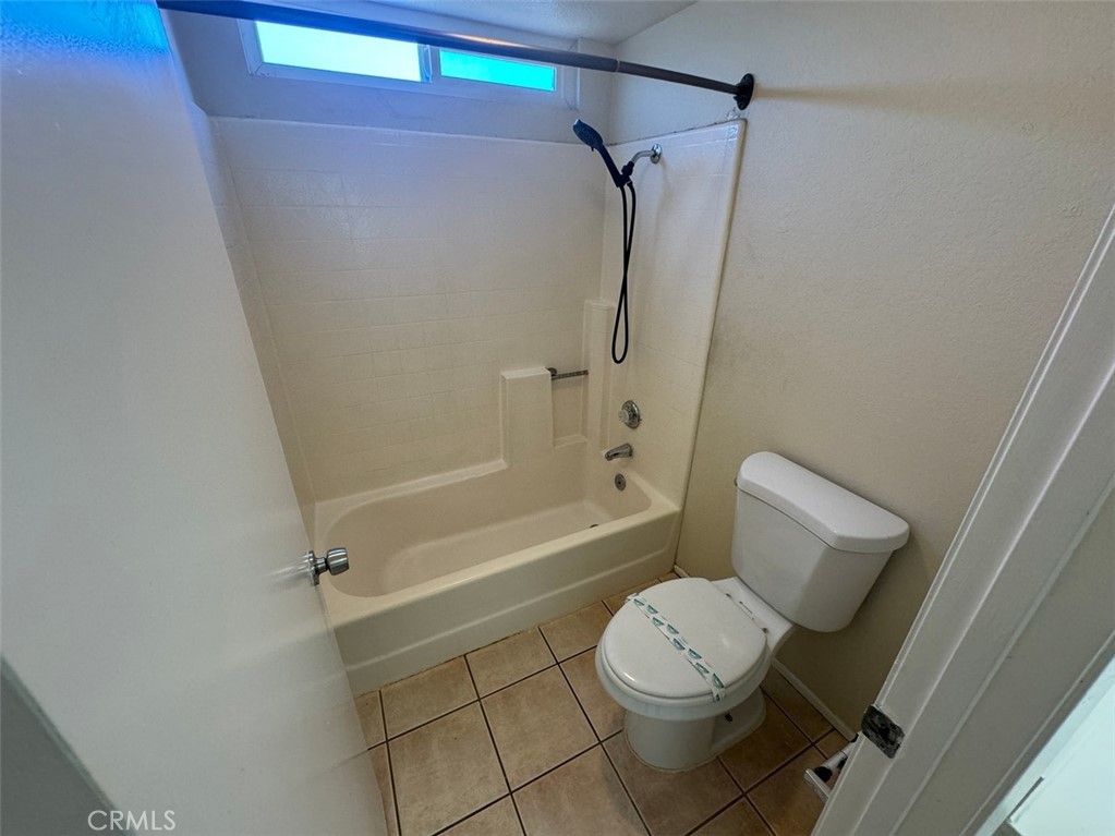 13080 Mohican Drive Moreno Valley, CA 92555 - Photo 32 of 38 a bathroom with a toilet and shower