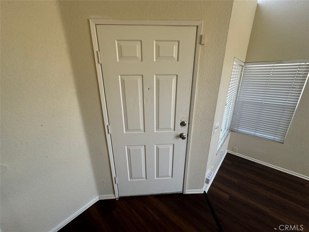 13080 Mohican Drive Moreno Valley, CA 92555 - Photo 5 of 38 a view of empty room with wooden floor