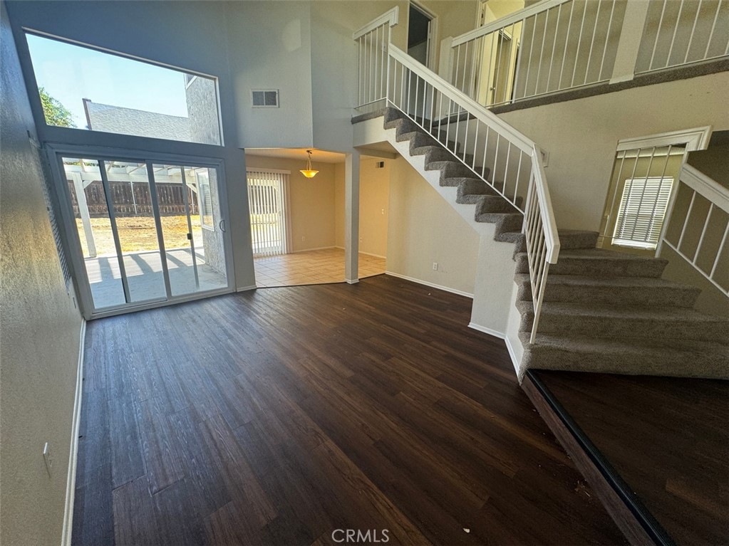 13080 Mohican Drive Moreno Valley, CA 92555 - Photo 8 of 38 a view of entryway and hall with wooden floor