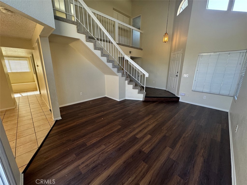 13080 Mohican Drive Moreno Valley, CA 92555 - Photo 9 of 38 a view of entryway and hall with wooden floor