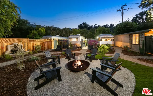 a terrace of a house with outdoor seating