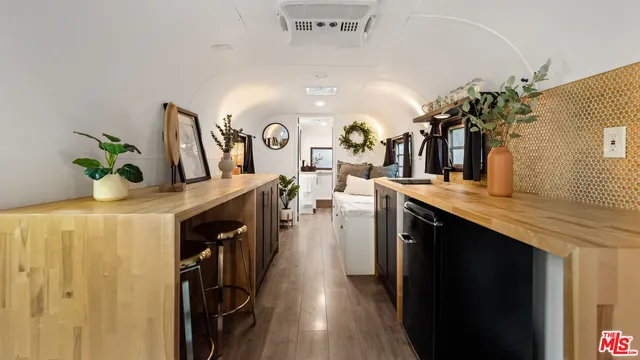 a kitchen with stainless steel appliances a counter top space