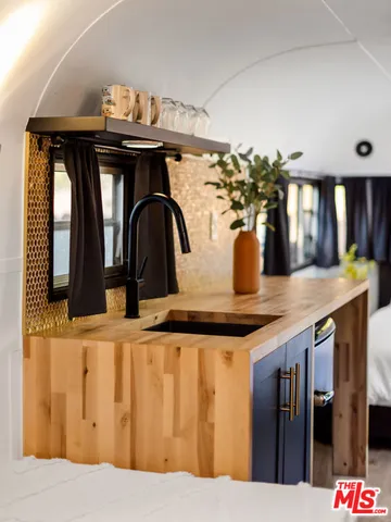 a kitchen with a table and chairs