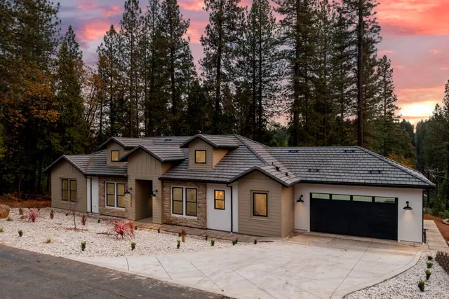 a front view of a house with yard