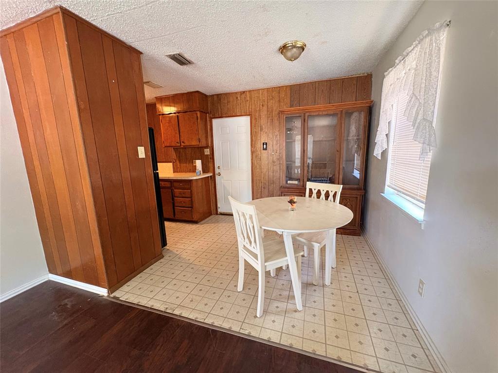 1829 South Center Street Denison, TX 75021 - Photo 9 of 29 a dining room with furniture and window
