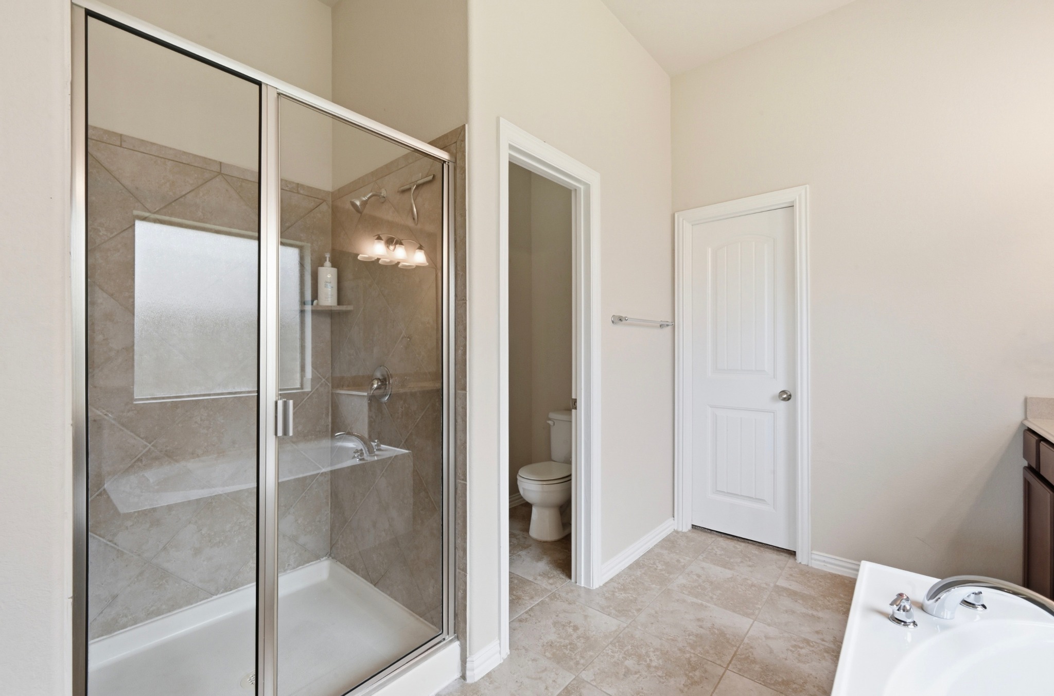 877 Hot Spring Valley Buda, TX 78610 - Photo 20 of 36 a bathroom with a shower and a glass door