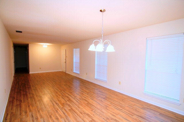 3384 Lacoste Road Mobile, AL 36618 - Photo 2 of 21 Spacious Living Room/ Dining Room Combo with beautiful, new floors and new lighting. 31 x 12