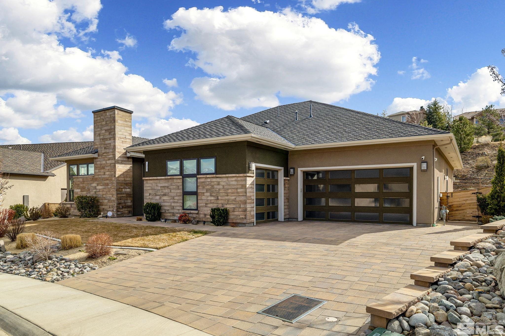 4045 Whispering Pine Loop Reno, NV 89519 - Photo 36 of 39 a front view of a house with a yard