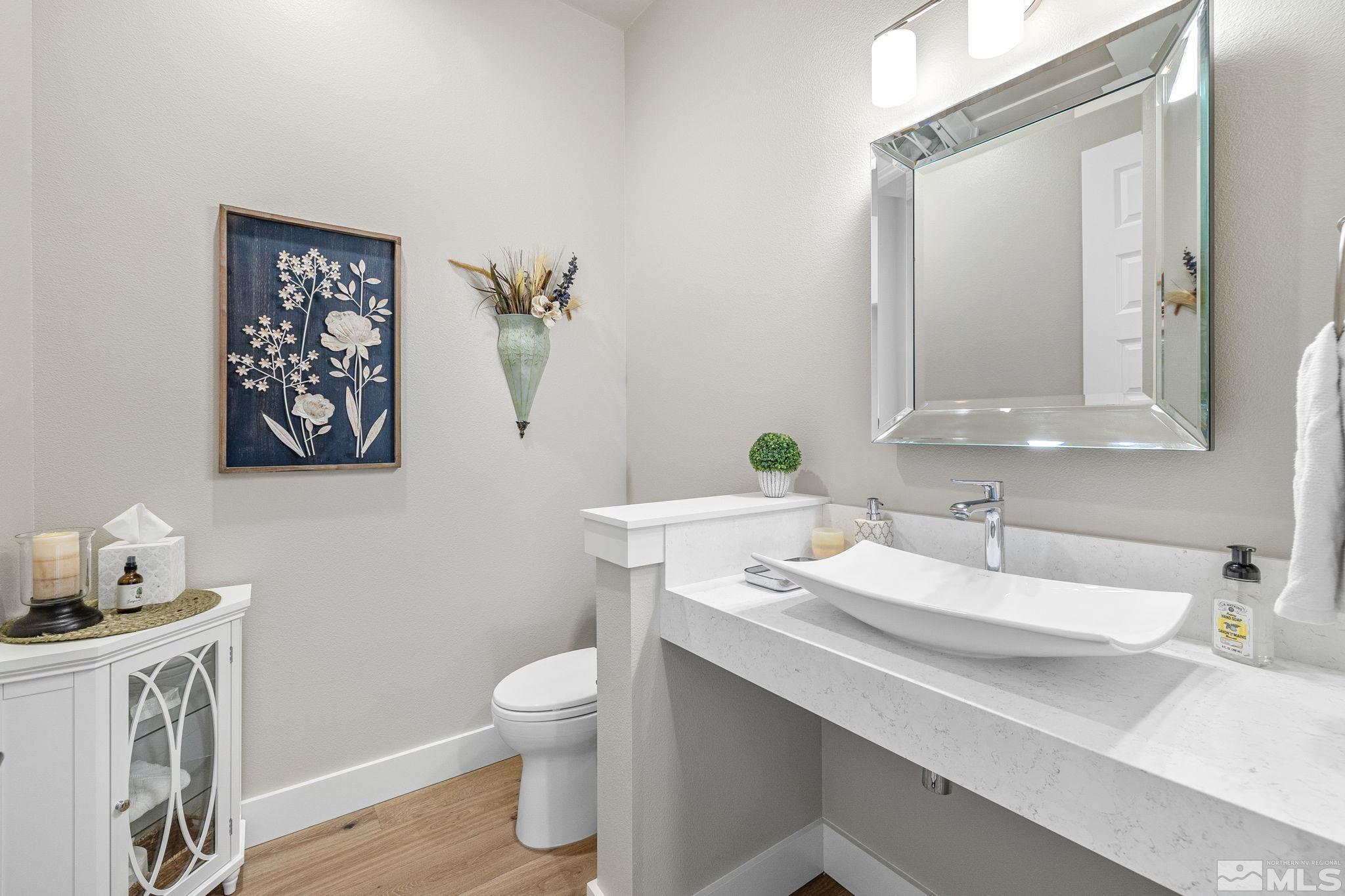 4045 Whispering Pine Loop Reno, NV 89519 - Photo 5 of 39 a bathroom with a sink and a toilet