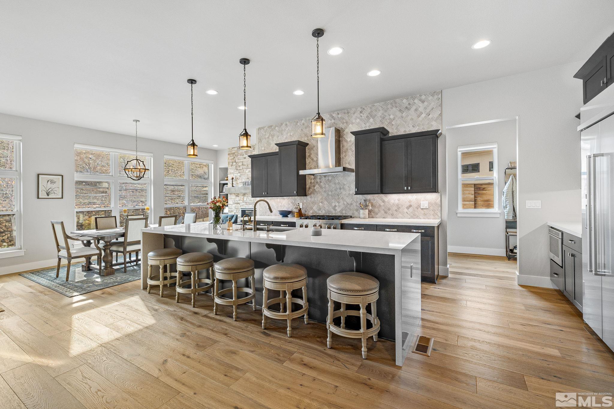 4045 Whispering Pine Loop Reno, NV 89519 - Photo 10 of 39 a large kitchen with a table and chairs