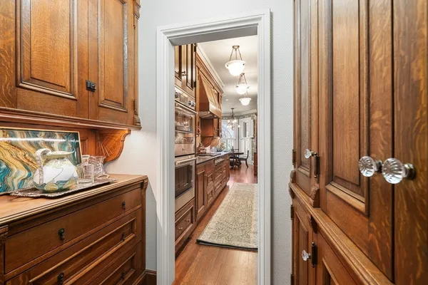 a view of a kitchen from the hallway