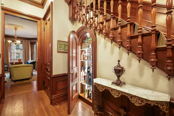 a view of living room kitchen and entryway