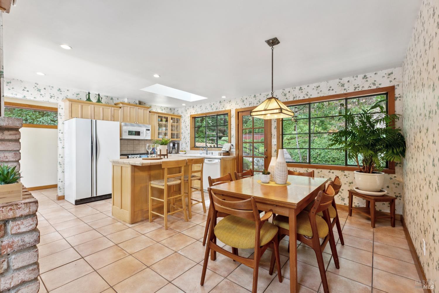 1311 West Dry Creek Road Healdsburg, CA 95448 - Photo 11 of 37 a dining room filled with furniture and a floor to ceiling window