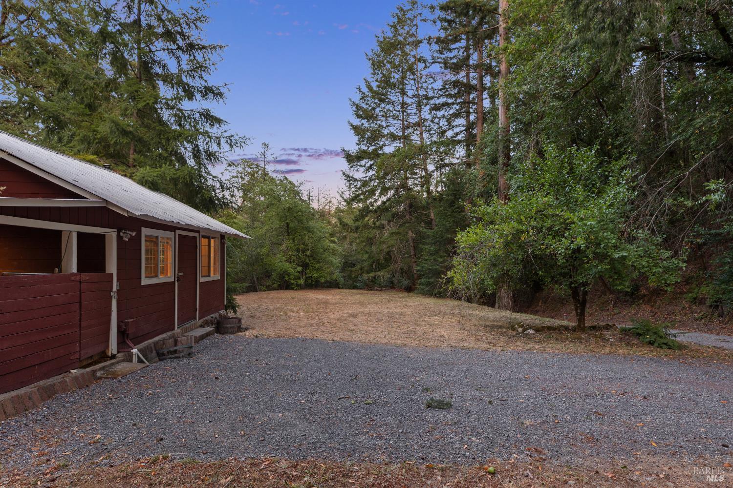1311 West Dry Creek Road Healdsburg, CA 95448 - Photo 32 of 37 a view of a barn in the middle of a yard