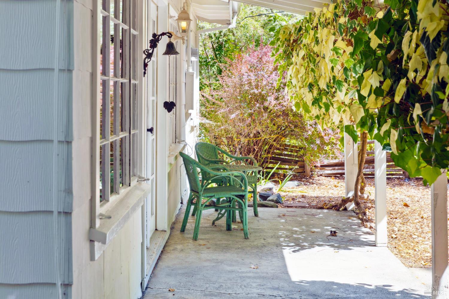 1311 West Dry Creek Road Healdsburg, CA 95448 - Photo 5 of 37 a view of a patio with table and chairs and potted plants