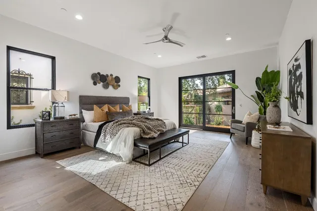 a bedroom with a large bed and a couch