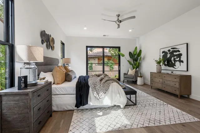 a living room with furniture fireplace and window