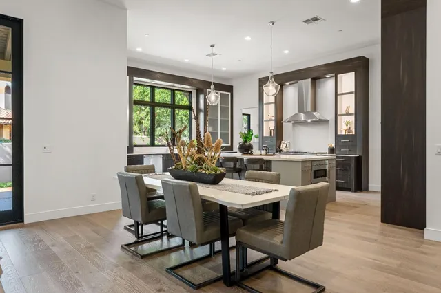 a view of a dining room with furniture window and outside view