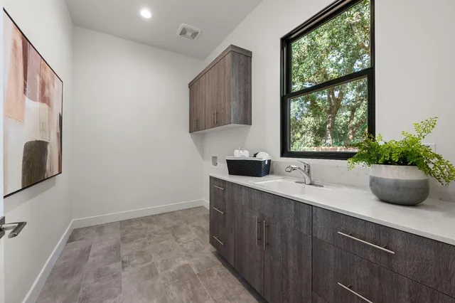 a kitchen with a sink and a window
