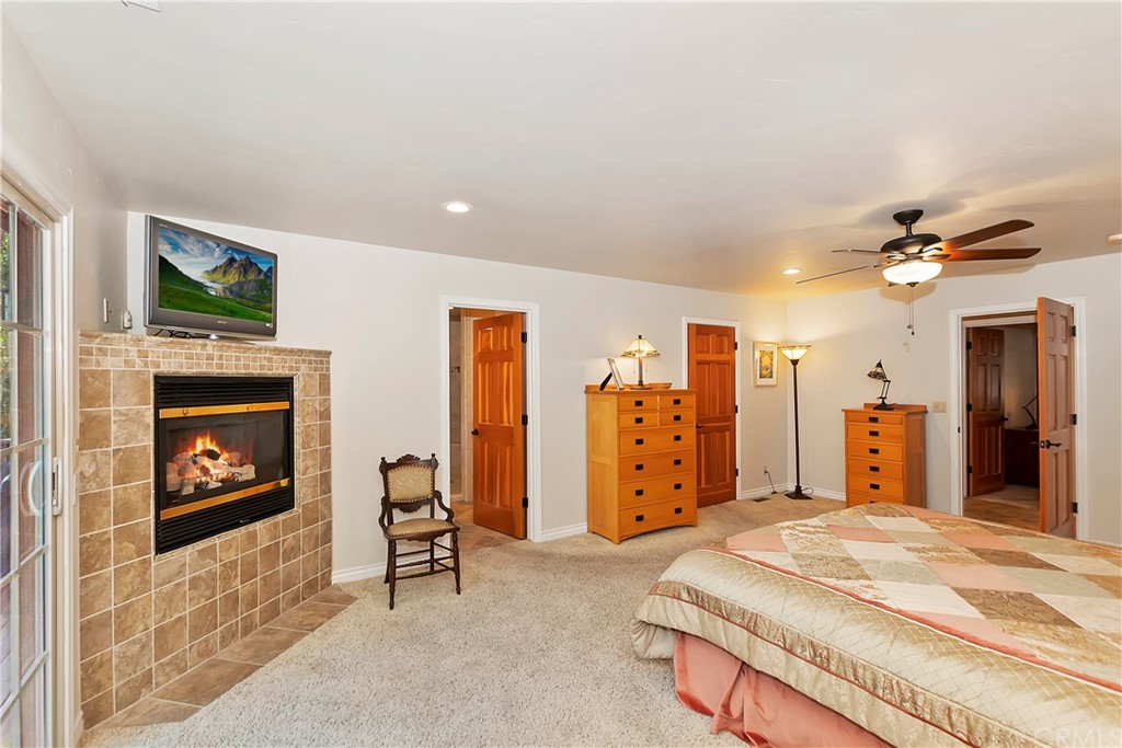 24310 Albrun Drive Crestline, CA 92325 - Photo 17 of 39 a bed room with a bed and a television