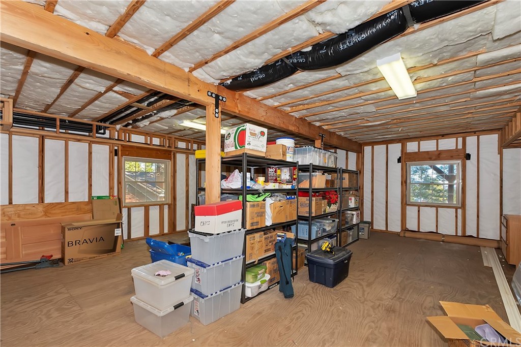 24310 Albrun Drive Crestline, CA 92325 - Photo 30 of 39 a room with lots of wooden furniture and a shower