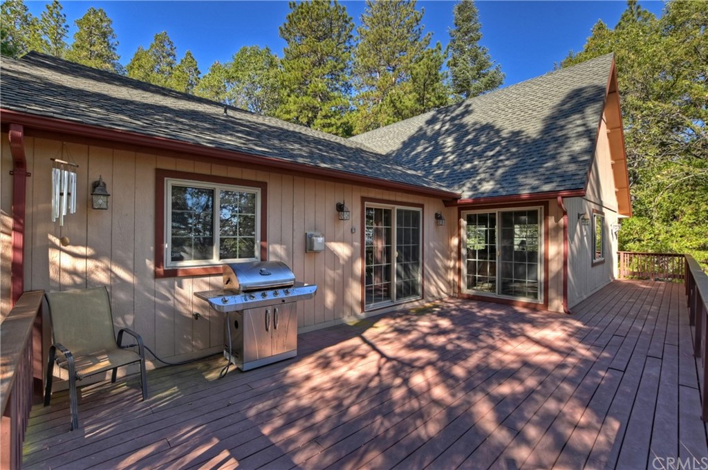 24310 Albrun Drive Crestline, CA 92325 - Photo 32 of 39 a view of a house with backyard porch and sitting area
