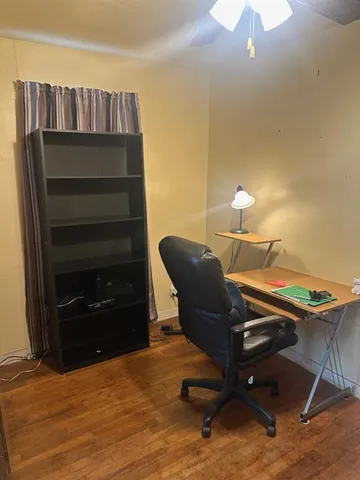 a workspace with furniture and a fireplace