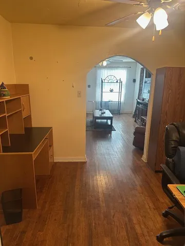 a view of a livingroom with furniture and wooden floor