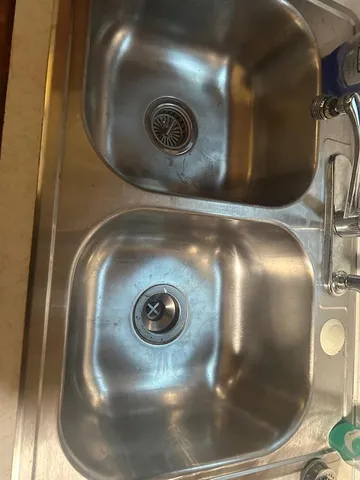 a view of a hardwood floor and staircase