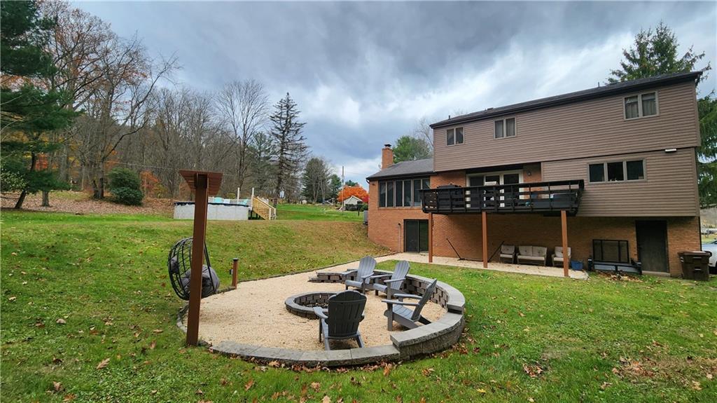 107 Spring Hollow Drive Apollo, PA 15613 - Photo 36 of 40 a swimming pool with outdoor seating and yard