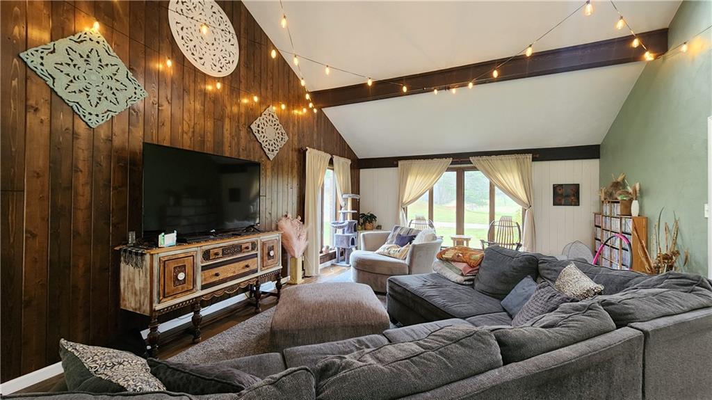 107 Spring Hollow Drive Apollo, PA 15613 - Photo 7 of 40 a living room with furniture a flat screen tv and a fireplace