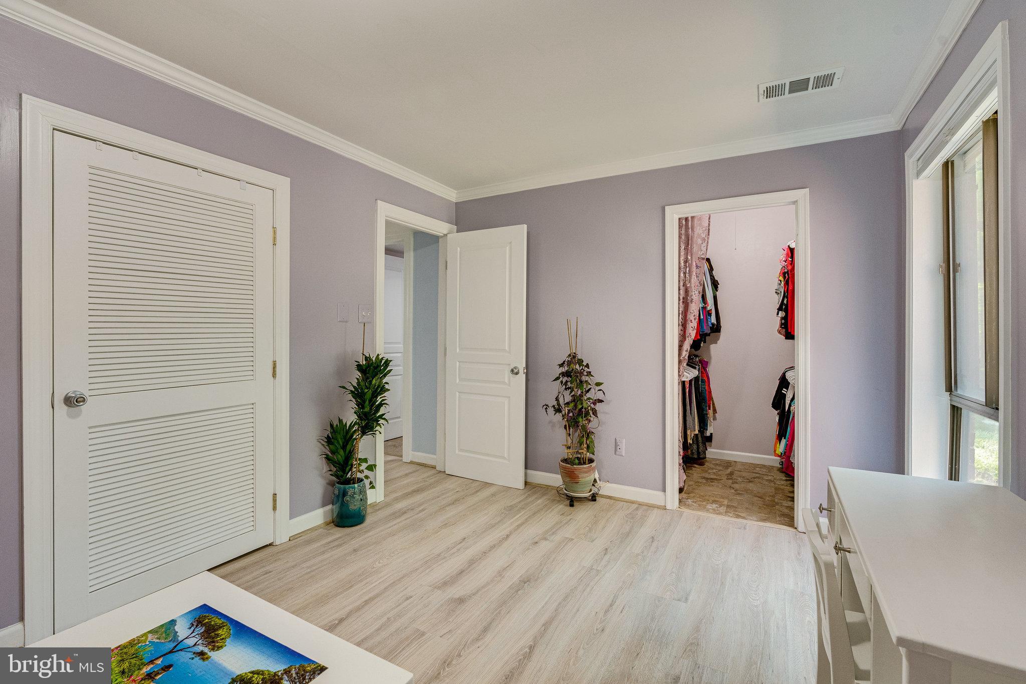 11256 Chestnut Grove Square, Unit 11256142 Reston, VA 20190 - Photo 16 of 31 Spacious bedroom with walk in closet