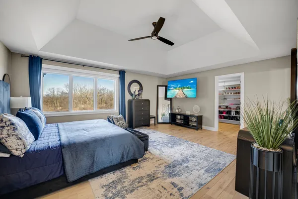 a bathroom with a tub a sink and a window