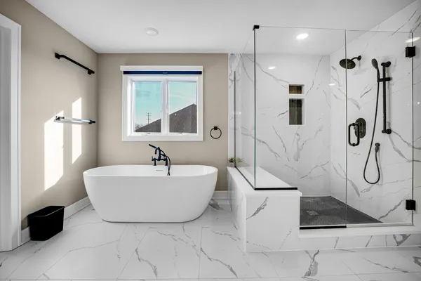 a spacious bathroom with a double vanity sink a mirror and shower