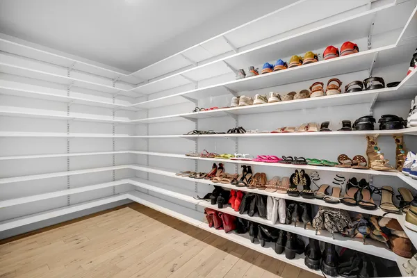 an empty room with window and ceiling fan