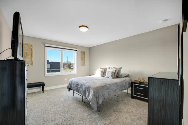 a bathroom with a granite countertop sink toilet a mirror a vanity and shower