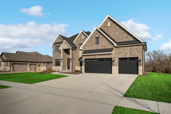 an aerial view of a house with a garden