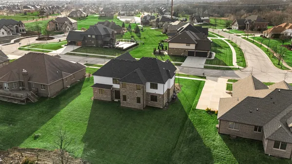 a view of a house with backyard